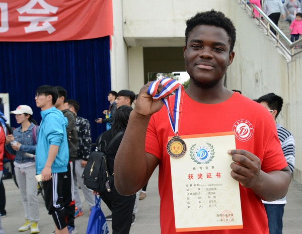 Nelson coming from Ghana ranked third in men’s shot put